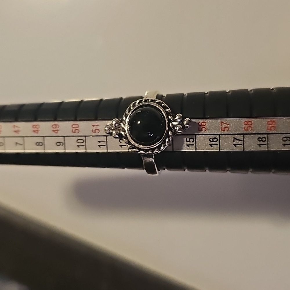 Elegant Silver Tone Ring with Black Stone